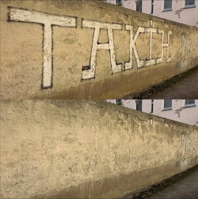 Graffiti an Gartenvereins-Mauer in Berlin vor der Entfernung