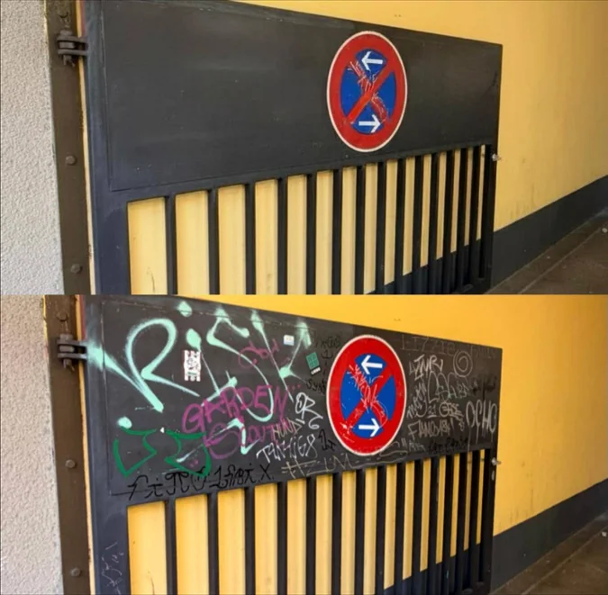 Graffiti an einem Metall-Zufahrtstor in Berlin